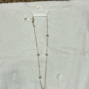 Gold now and pearl necklace